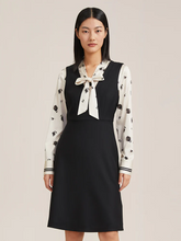 a lady in black mini silk dress